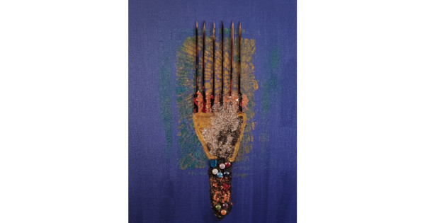 Ebony Beauty Heritage by Serj Éty’n — framed mixed-media artwork displayed in a modern living room, featuring a stylized Afro comb on a deep blue background with textured glitter, dark vertical spikes, and colorful bead details symbolizing Black heritage and identity.