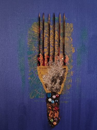 Ebony Beauty Heritage by Serj Éty’n — framed mixed-media artwork displayed in a modern living room, featuring a stylized Afro comb on a deep blue background with textured glitter, dark vertical spikes, and colorful bead details symbolizing Black heritage and identity.